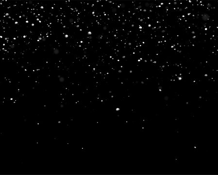 Snowfall is captured as white flakes scattered across a dark background. The flakes vary in size and density, with a soft focus effect on some particles.