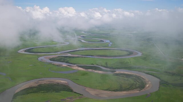 High-Angle Aerial Panoramic View of Meandering River and Sea of Clouds in Zoige Wetland: Yellow River Upper Reaches, Winding Stream, Green Prairie, Blue Sky and Cloud Background