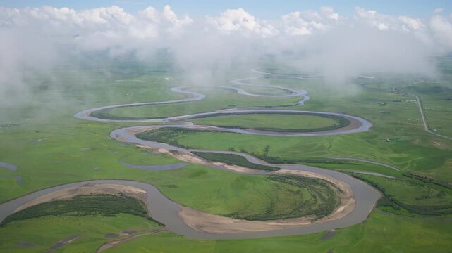 High-Angle Aerial Panoramic View of Meandering River and Sea of Clouds in Zoige Wetland: Yellow River Upper Reaches, Winding Stream, Green Prairie, Blue Sky and Cloud Background