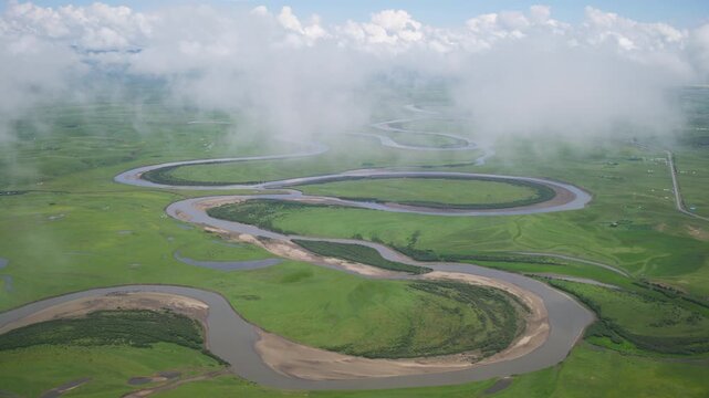 High-Angle Aerial Panoramic View of Meandering River and Sea of Clouds in Zoige Wetland: Yellow River Upper Reaches, Winding Stream, Green Prairie, Blue Sky and Cloud Background