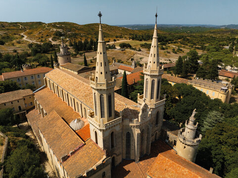 Aerial view of Frigolet Abbey church and twin spires