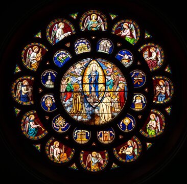 Figurative stained glass rose window in a church