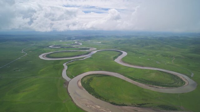 High-Angle Aerial Panoramic View of Meandering River and Sea of Clouds in Zoige Wetland: Yellow River Upper Reaches, Winding Stream, Green Prairie, Blue Sky and Cloud Background