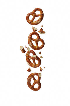 Broken pretzels png salty pretzel pieces png baked snack png falling pretzels transparent image