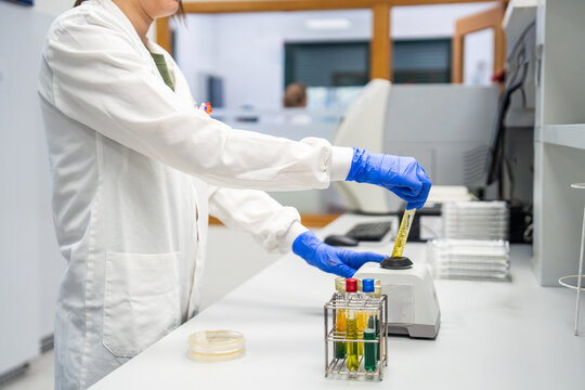 Scientist Using a Centrifuge in a Laboratory Setting