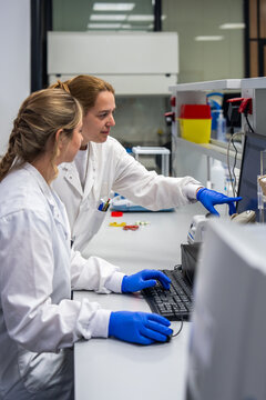 Scientists Work in a Modern Lab on Experiments and Data Analysis
