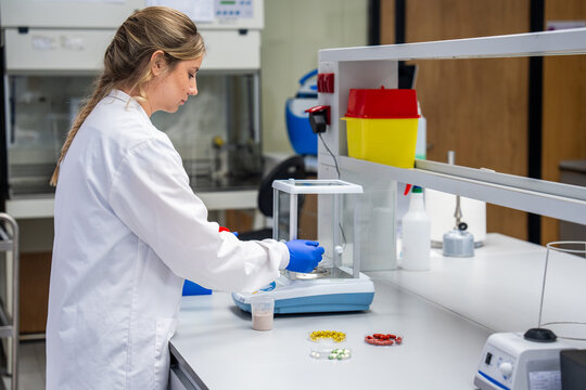 Researcher Works in a Lab With Tools and Materials on a Table