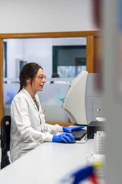Lab Technician Working at a Computer in a Science Laboratory