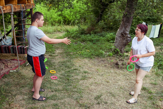 Outdoor activity with a child with Down syndrome at a camp