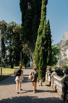 Mother and daughter walking beside Lake Garda in northern Italy