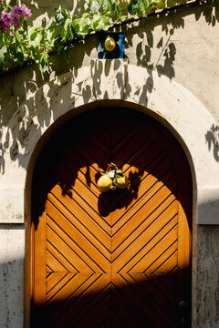 Mediterranean wooden doorway decorated with lemons and flowers