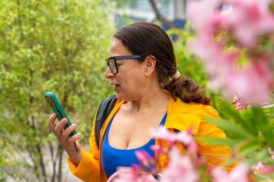 candidly talking on cellphone speakerphone