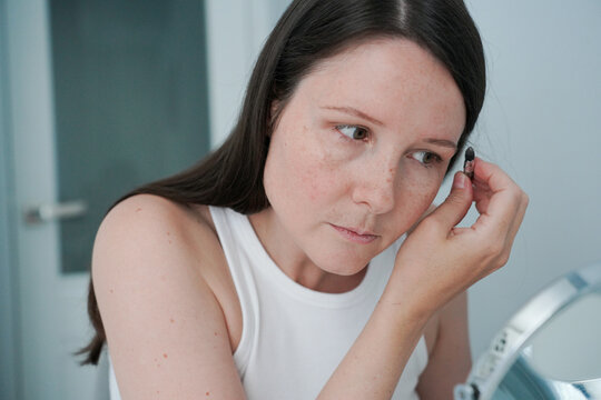 Close-Up Of Woman Applying Eye Makeup