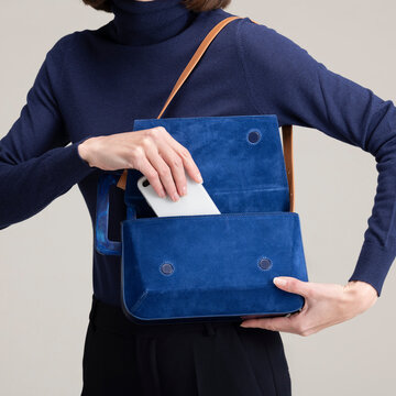 Blue Handbag and Phone With Navy Turtleneck
