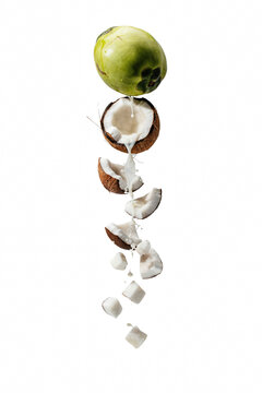 Coconut pieces with milk falling down.