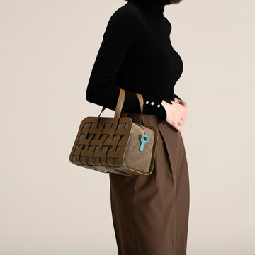 Elegant Black Turtleneck With Designer Bag
