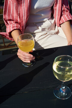 Woman holding glass of cider