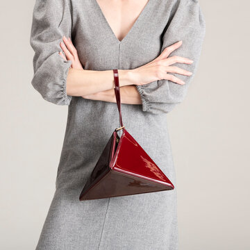 Elegant Grey Dress With Red Handbag