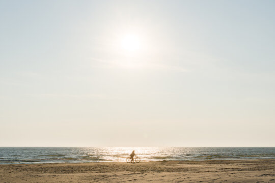 Biking Along the Shoreline at Sunset