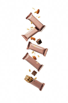 Stack of granola bars falling with ingredients.
