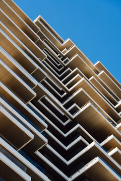 Geometric Balconies Against a Blue Sky