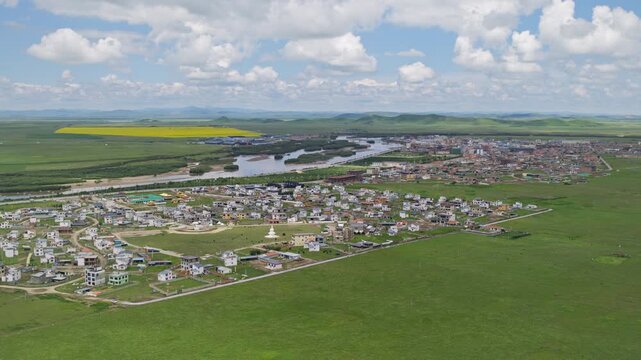 High-Angle Aerial Panoramic View of Tangke Town in Zoige, Aba, Sichuan: Plateau Grassland, Yellow River Basin, Rapeseed Fields, Blue Sky and Horizon Background