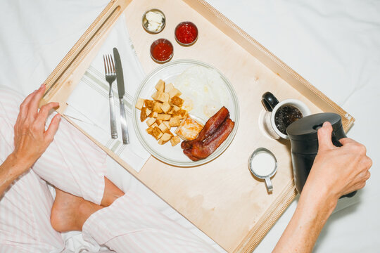 Pouring Coffee Hotel Breakfast in Bed