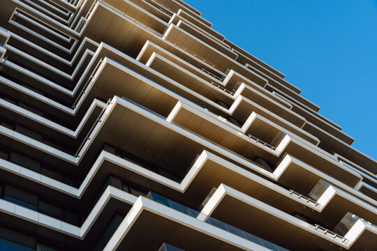 Geometric Balconies Against a Blue Sky