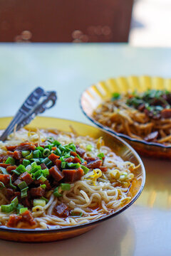 Plate of hot noodle soup with herbs and dried fish. Popular food in Sabang island called Mie Sedap. Popular tourist destination