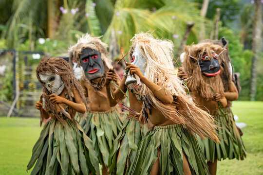  Masked performer wearing a distinctive natural fiber costume during a cultural performance in Rabaul, Papua New Guinea. Travel photography documenting traditional cultural expression.