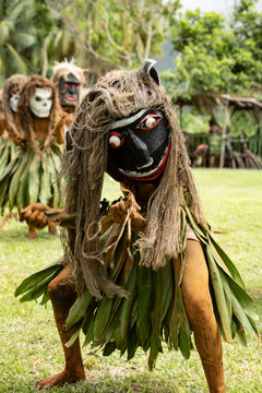  Masked performer wearing a distinctive natural fiber costume during a cultural performance in Rabaul, Papua New Guinea. Travel photography documenting traditional cultural expression.