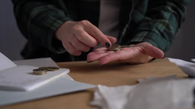 Close Up of Woman Hands Counting  Coins for Budget and Savings