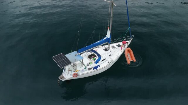 Aerial view of the sailing boat in the calm sea