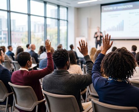 Diverse audience engaging in a Q&A session during a corporate presentation in a modern conference room