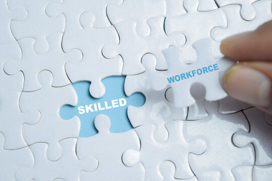 Piece of jigsaw puzzle skilled workforce phrase. For hiring talent and human resources