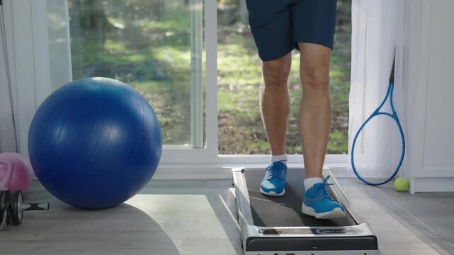 Exercise cardio. Sport man legs do sport. Sportsman has cardio workout to burn calories. Sneakers walking. Sportsman running on treadmill in gym. Treadmill workout in fitness gym. Run machine