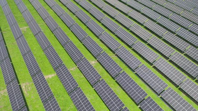 Top-Down Aerial Close-Up View of Solar PV Panel Array on Zoige Grassland: Renewable Clean Energy, Agrivoltaics, Green Field and Sunlight Background