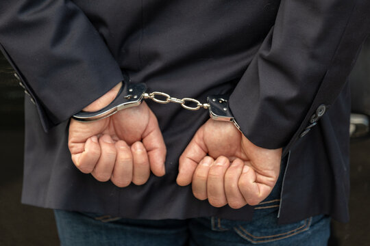 Concept of arrest, criminal investigation, restricted freedom, legal responsibility and detention of a suspect by authorities.