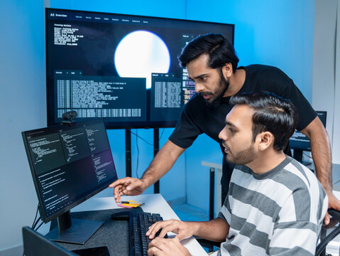 Software engineering use computer working develop AI office are assisting algorithm systems or verifying code. Programmer teamwork using artificial intelligence on laptop analysis or writing coding