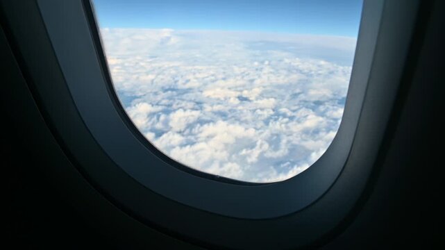 View of clouds through an airplane window
