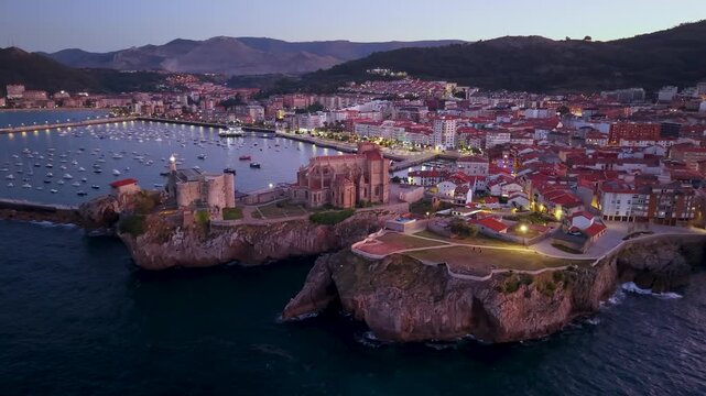 Aerial view from a drone of the Castro Urdiales port, the Church of Santa Mar&iacute;a, and the Santa Ana Castle Lighthouse. Castro Urdiales Municipality. Cantabrian Sea. Cantabria. Spain. Europe.