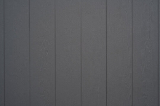 Dark grey wood effect panels with subtle grain texture and vertical pattern