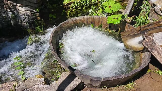 Traditional wooden washing facility powered by flowing water in Bulgaria