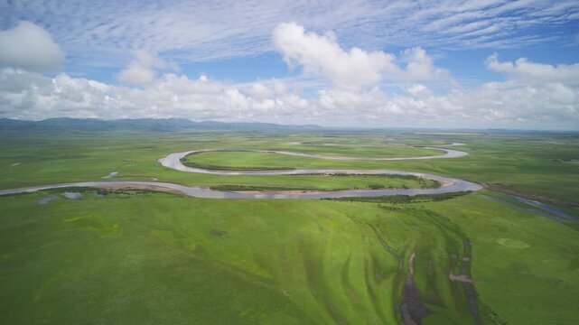 High-Angle Aerial Panoramic View of Meandering River and Sea of Clouds in Zoige Wetland: Yellow River Upper Reaches, Winding Stream, Green Prairie, Blue Sky and Cloud Background