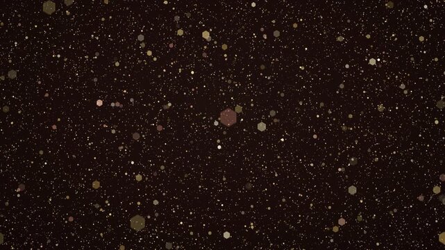 Golden dust particles and hexagon bokeh drifting on a dark brown background, glittering gold and rose specks floating
