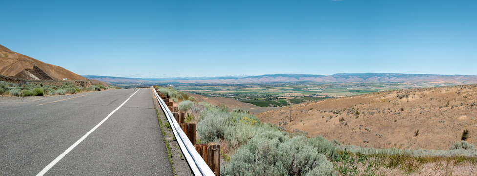 Panorama of the road leading to Manastash Vista Point overlooking farms near Ellensburg, Washington, USA