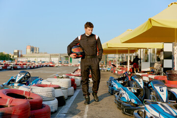 Young race car driver preparing for karting competition © Nomad_Soul