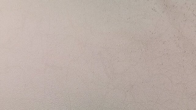 Drone top down view of cracked dry soil on dried reservoir bottom, global warming and severe drought texture background