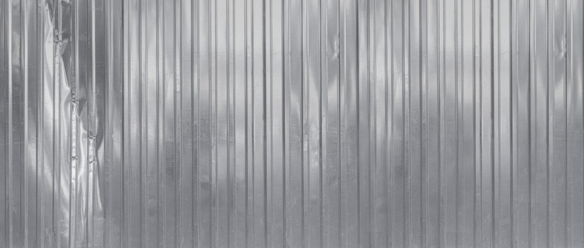 Corrugated metal sheet surface showing textured pattern