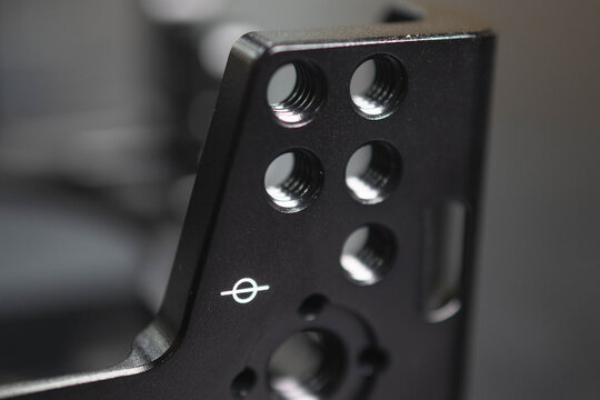 Aluminum frame with screw threads copy space engineered design, macro metal, thread abstract close up